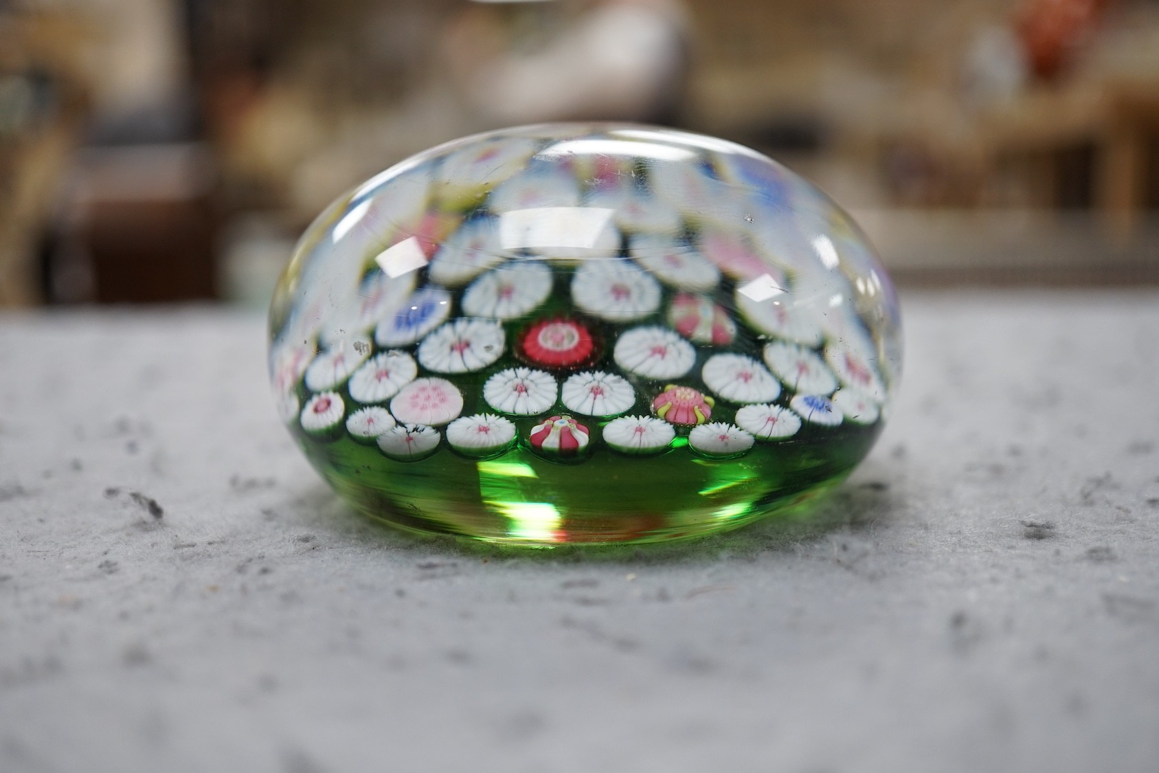 A 19th century French glass millefleur spaced cane paperweight, 8.5cms diameter